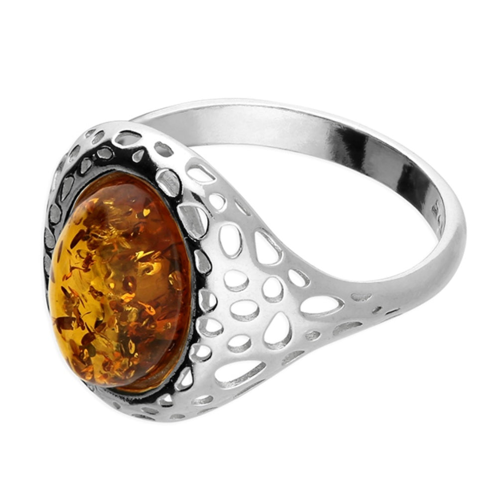 Oval cognac amber with a decorative openwork design on the shoulders
