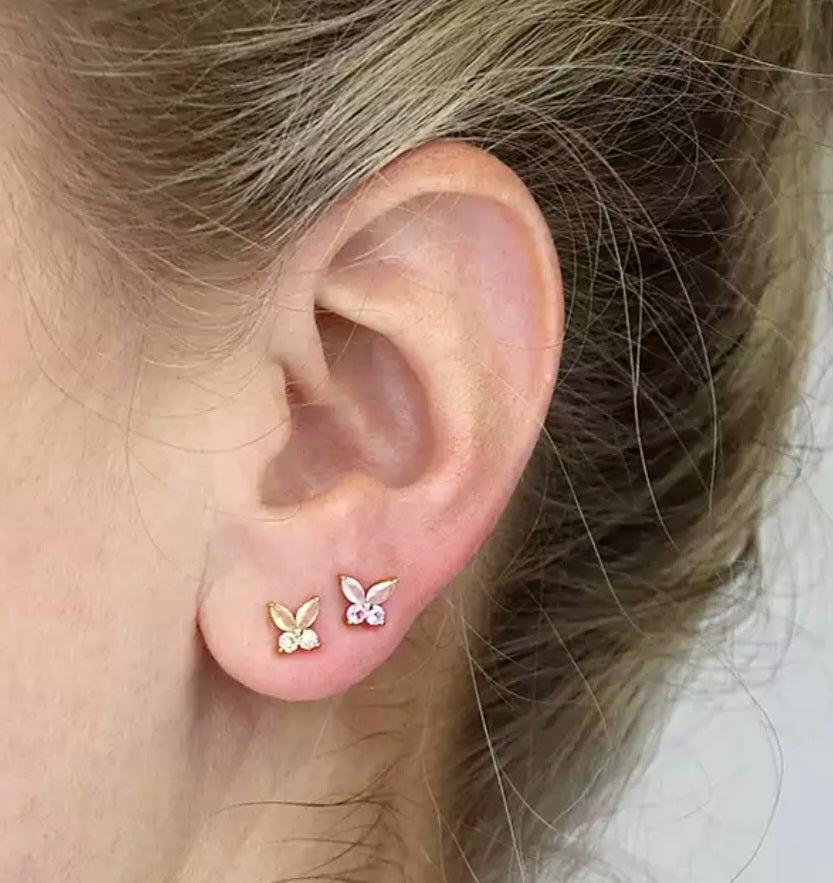 Yellow gold plated. Asymmetric yellow and pink glass and cubic zirconia butterfly stud