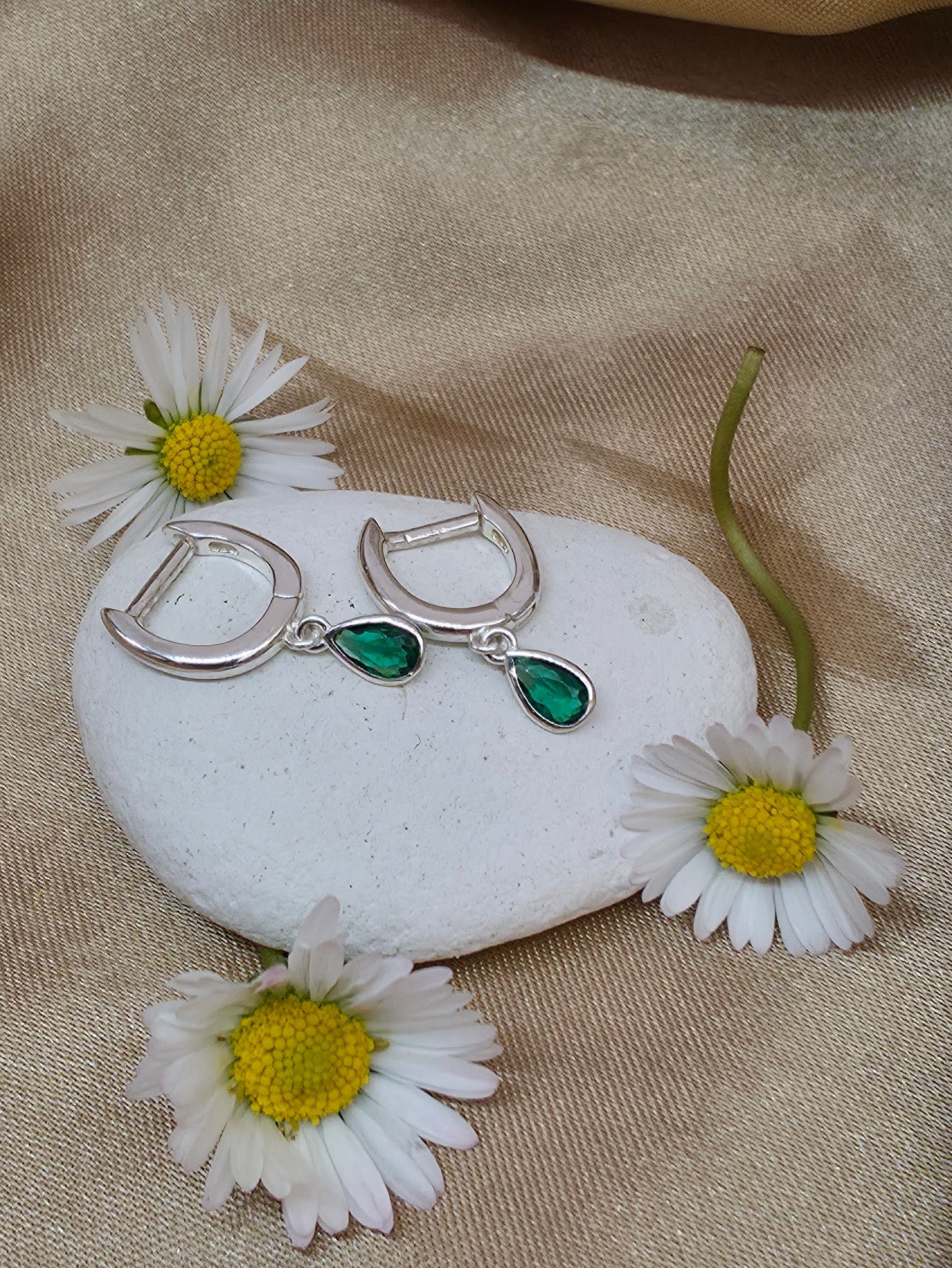 Horseshoe huggie hoop with a flat emerald  teardrop charm
